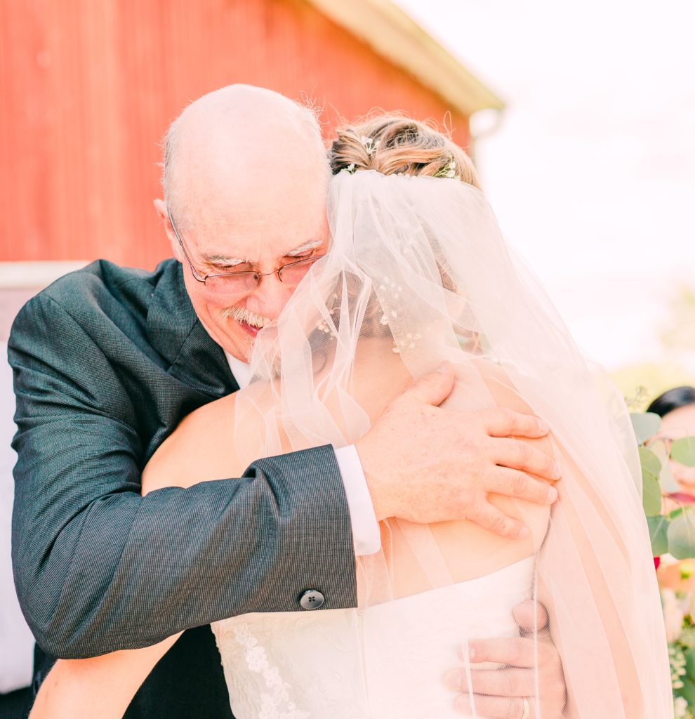 bride hugging her dad on wedding day