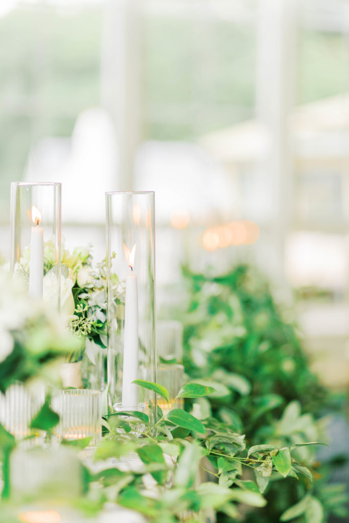 greenery and candle wedding centerpiece