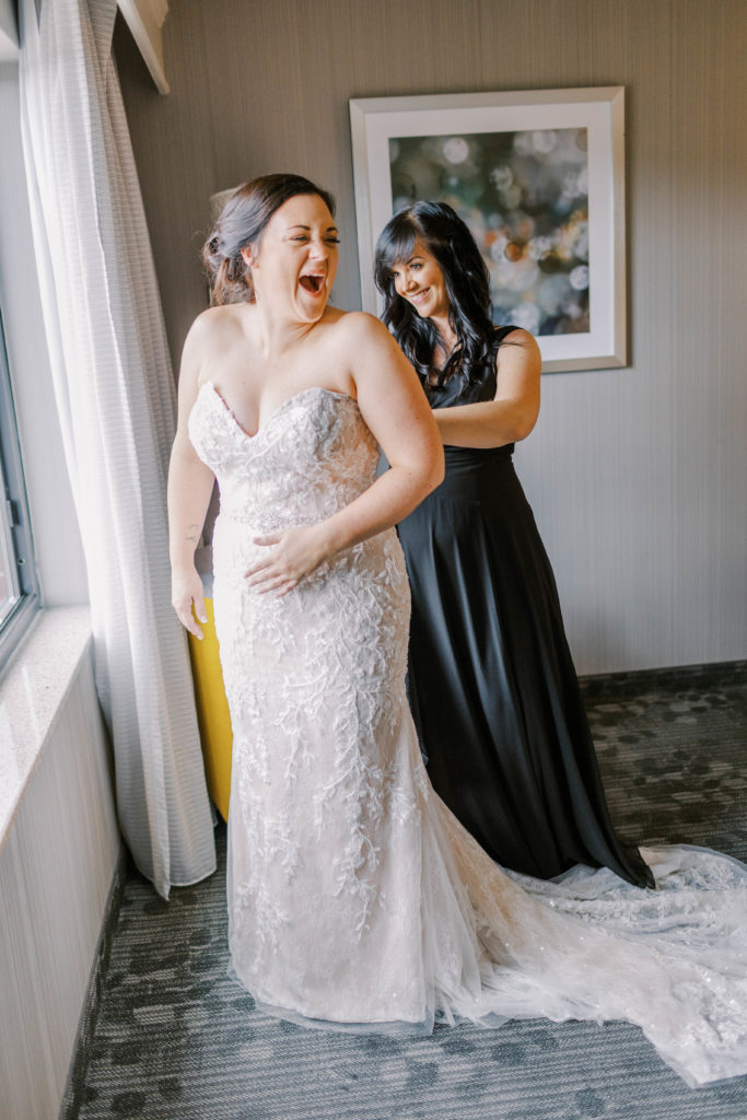 bride laughing with her sister
